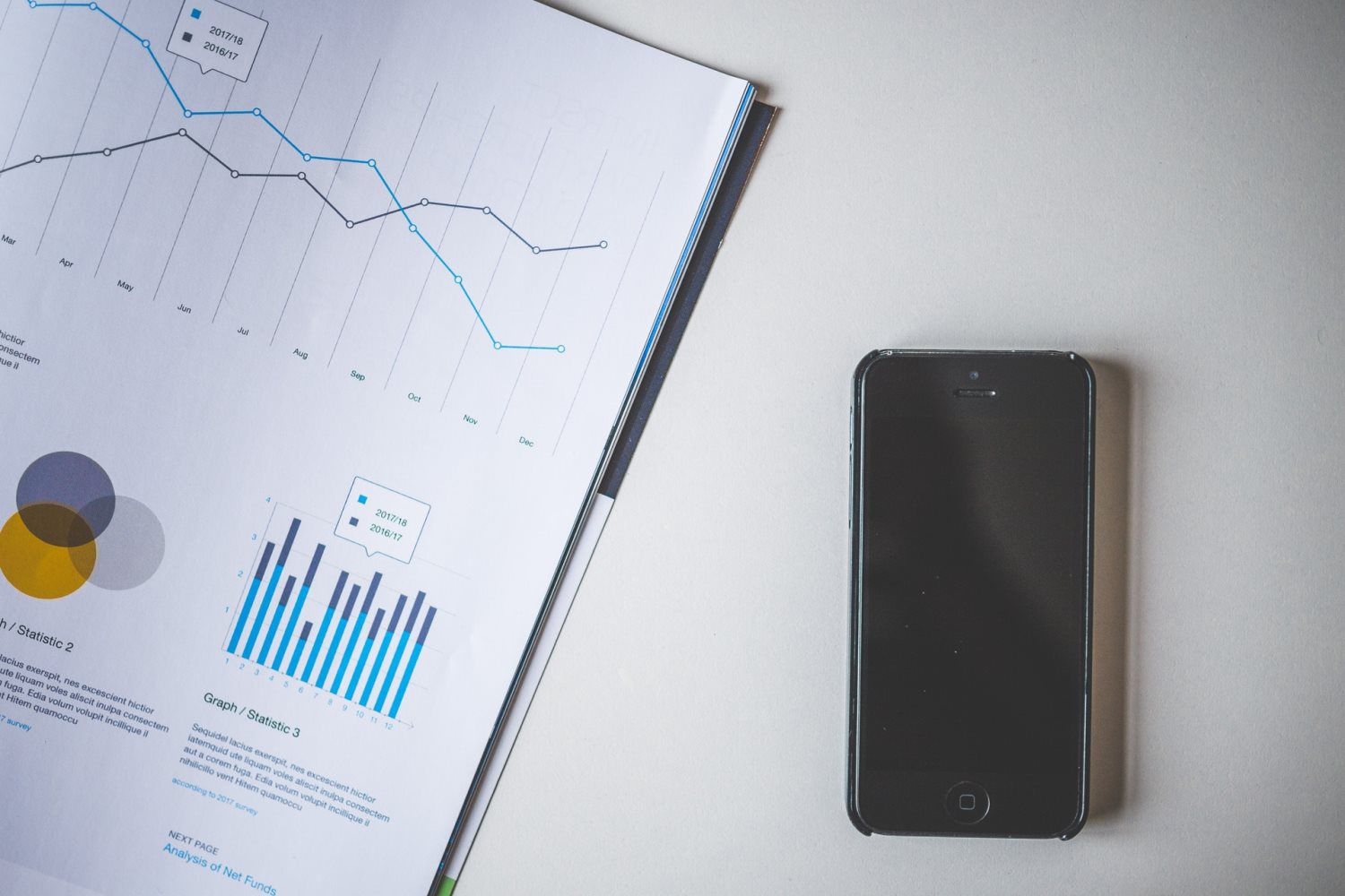 smartphone on table with documents